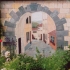 Trompe l'oeil muurschildering "Toscaanse poort"
